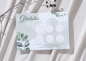 Preview: Personalisierte Glückslos-Karte mit dem Namen „Steffi“ im Eukalyptus-Design mit grünen Blättern und zartem Aquarellhintergrund. Die Karte liegt auf hellem Stoff neben einem Zweig und zeigt sechs leere Rubbelfelder.