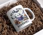 Preview: Weiße Tasse mit Halloween-Motiv von drei süßen Geistern, die ein Buch lesen, umgeben von Kürbissen und einem Fledermaus-Design, mit dem Text ‚Read More Boooooks‘. Perfekt für Halloween- und Bücherliebhaber.