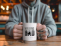 Preview: Mann mit Tätowierungen hält eine weiße Tasse mit der Aufschrift „The Walking Dad“ und dem personalisierten Namen „Kevin“, fotografiert in einem gemütlichen Café-Setting.