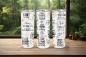 Preview: Drei weiße Thermobecher mit motivierenden Zitaten wie 'Believe in the impossible', 'Good things are coming', 'Life is tough but so are you' und 'You got this'. Die Becher sind mit floralen Mustern und sanften Pastelltönen dekoriert und stehen vor einem Wa