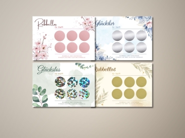 Vier personalisierte Rubbellose mit Namen „Steffi“ in unterschiedlichen Designs: Rosa Blumen mit Roségold-Stickern, blaue Blumen mit Silber, Eukalyptus mit Holografie und Boho-Gold mit goldenen Stickern. Alle Karten zeigen je sechs Rubbelfelder.