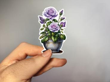 Aufkleber eines Blumenarrangements mit lila Rosen und grünen Blättern in einem verzierten blauen Topf. Ideal für dekorative Zwecke und kreative Projekte.