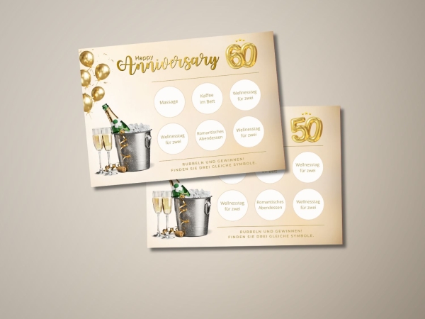 Zwei freigerubbelte Jubiläums-Rubbellose mit Champagner-Illustration. Die obere Karte zeigt „Happy Anniversary“ mit der Zahl 60 und dreifachem Gewinn „Wellnesstag für zwei“. Die untere Karte zeigt die Zahl 50 mit demselben Gewinnbegriff. Weitere Begriffe